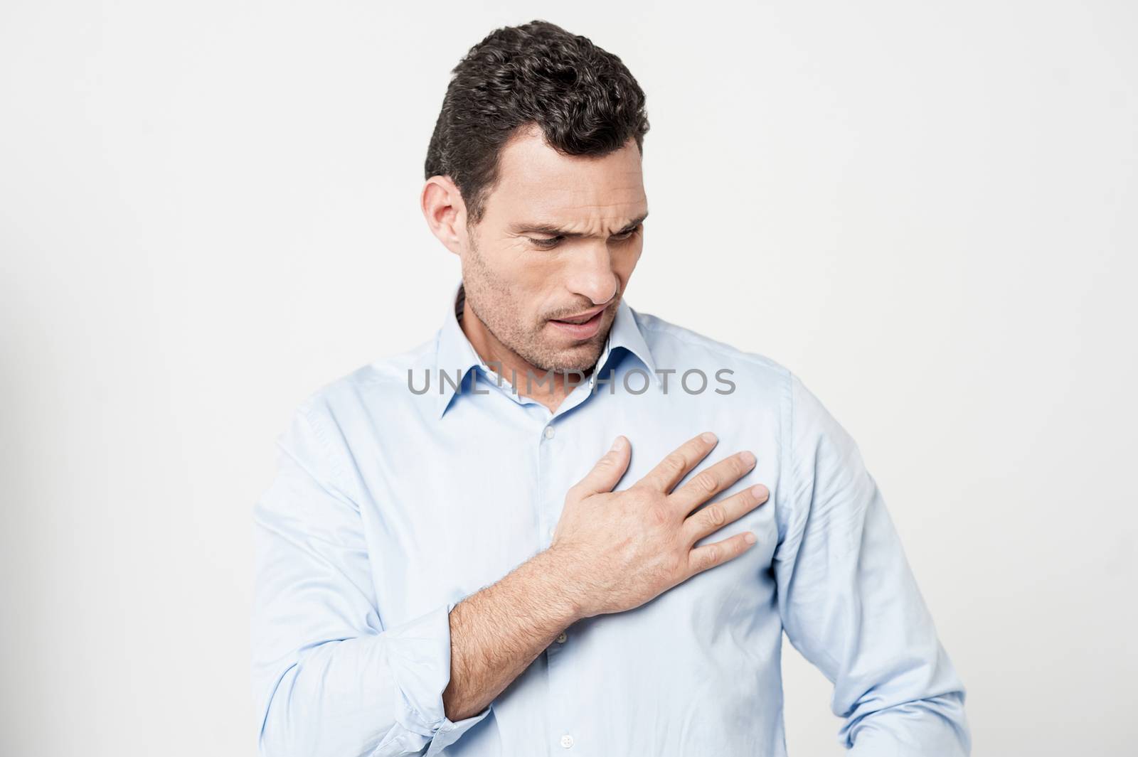 Man suffering from chest pain, heart attack.