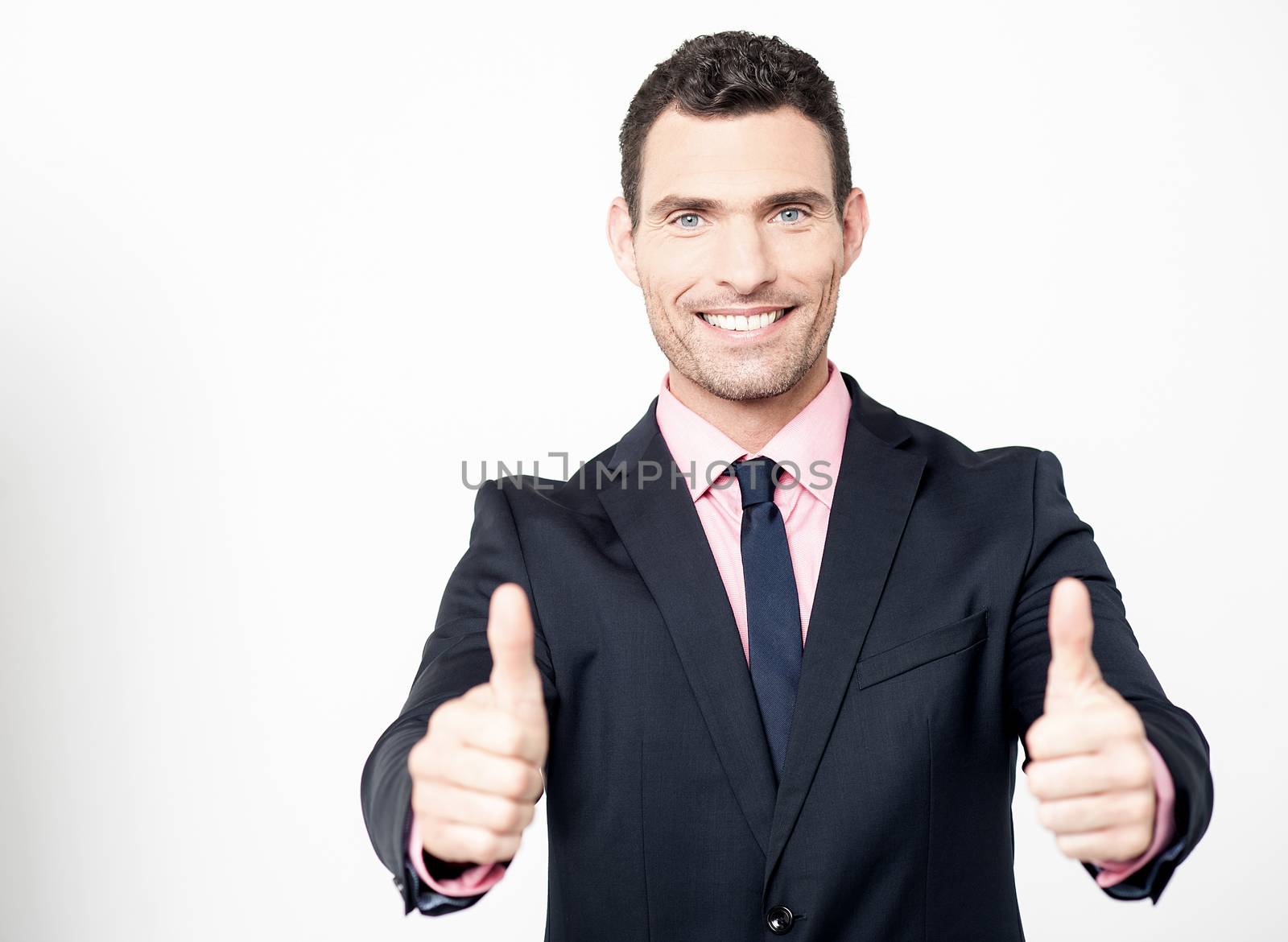 Successful businessman showing double thumbs up 