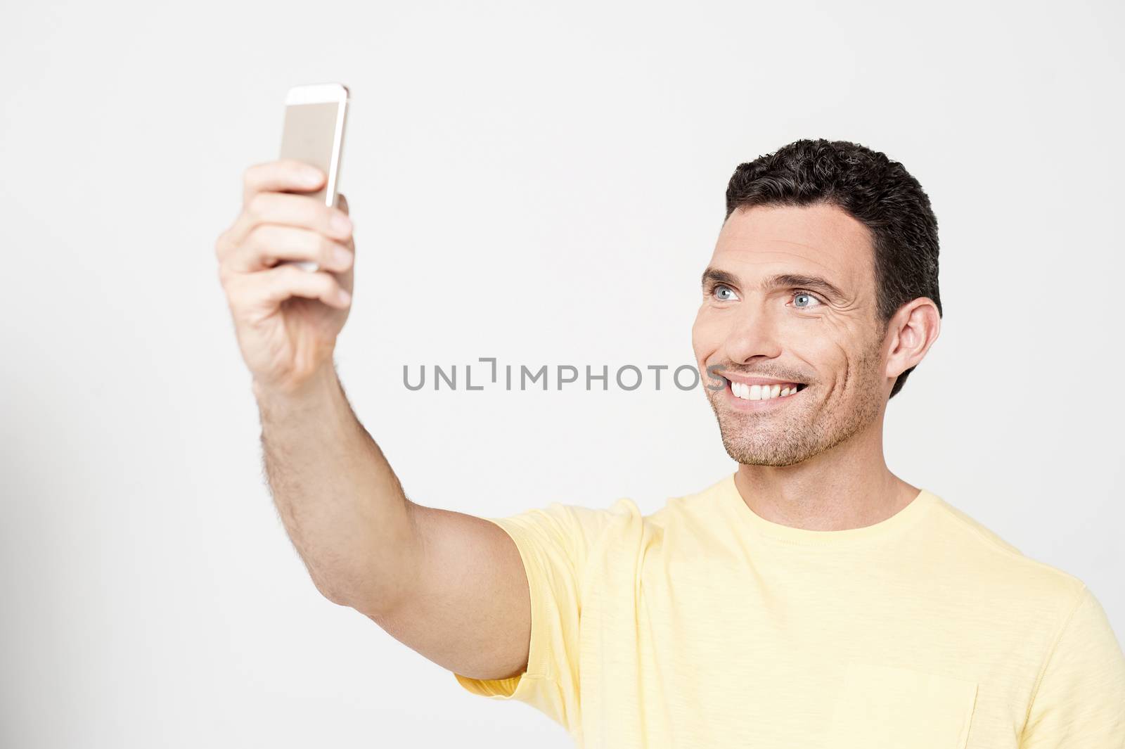 Happy man taking a picture of herself