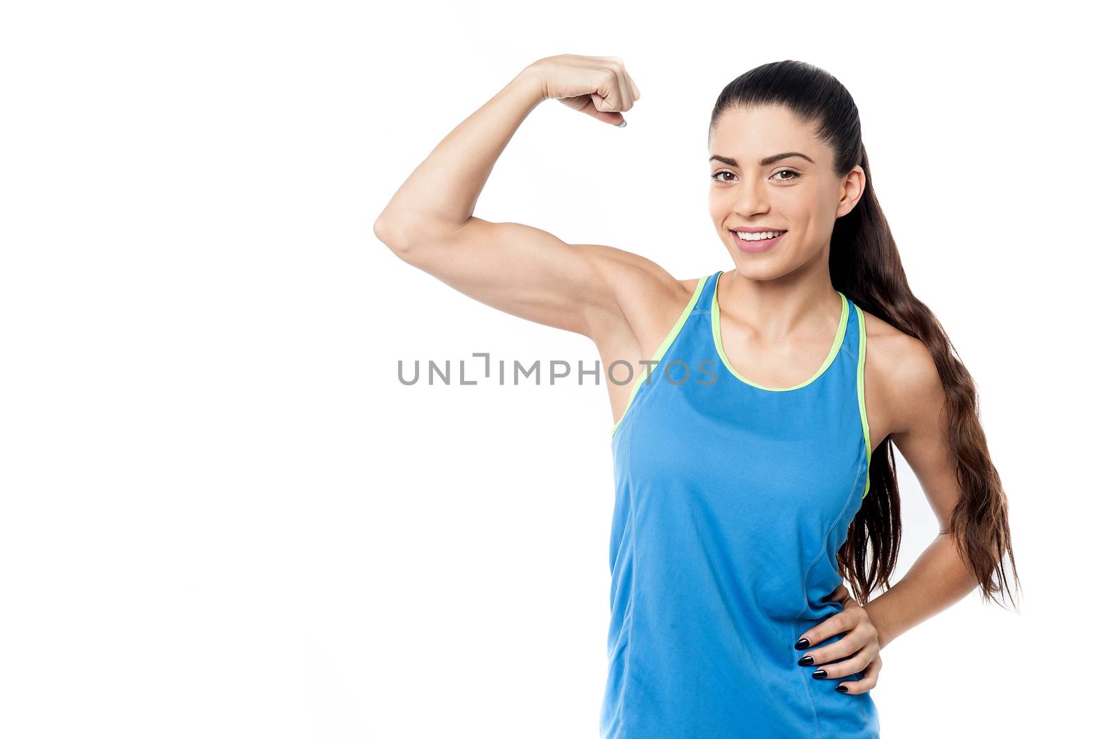 Sporty young woman showing her biceps