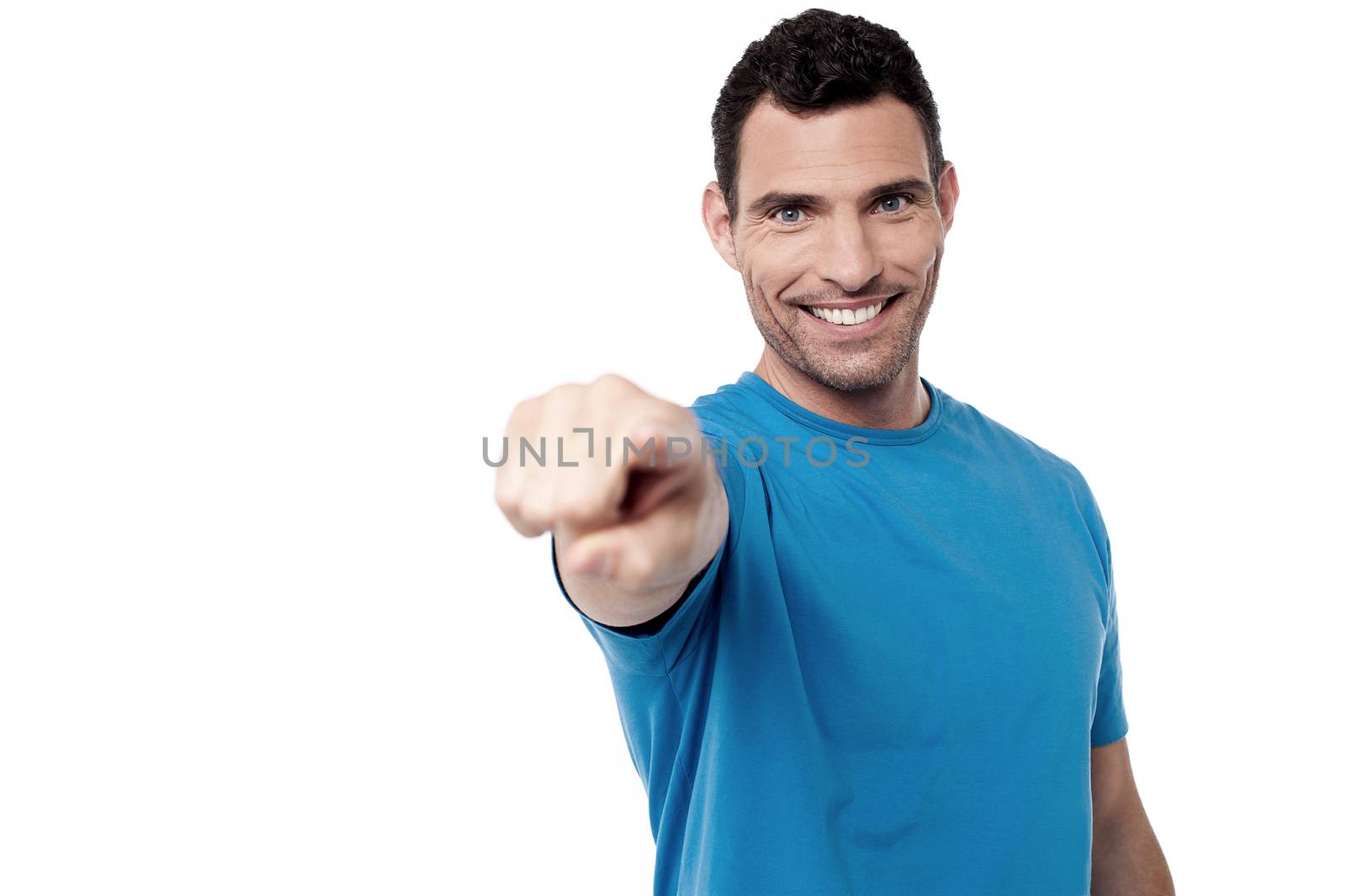 Casual man pointing towards to camera