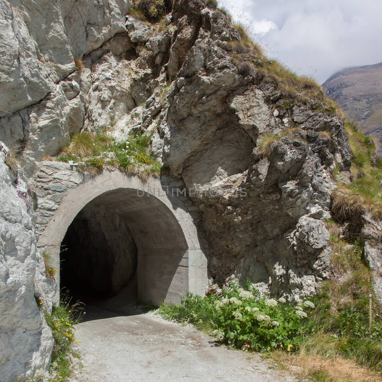 Small dark tunnel in a Swiss mountain