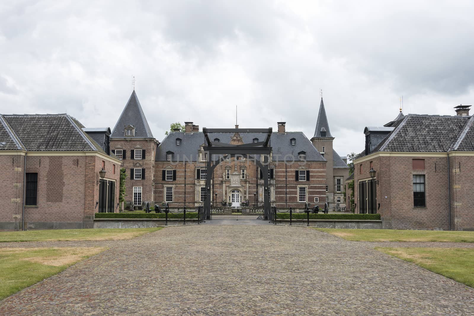 Late medieval castle 'Twickel' with drawbridge and old street near Delden in the Netherlands