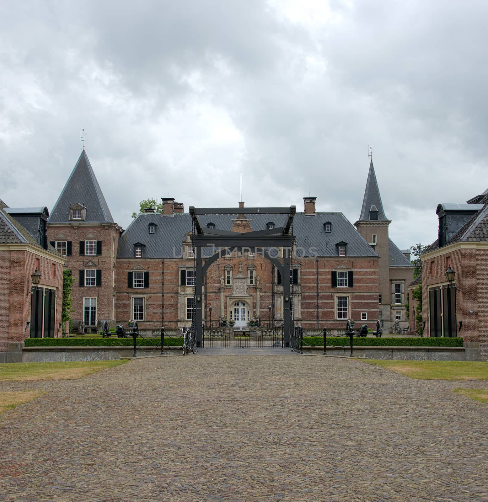 Late medieval castle 'Twickel' with drawbridge and old street near Delden in the Netherlands