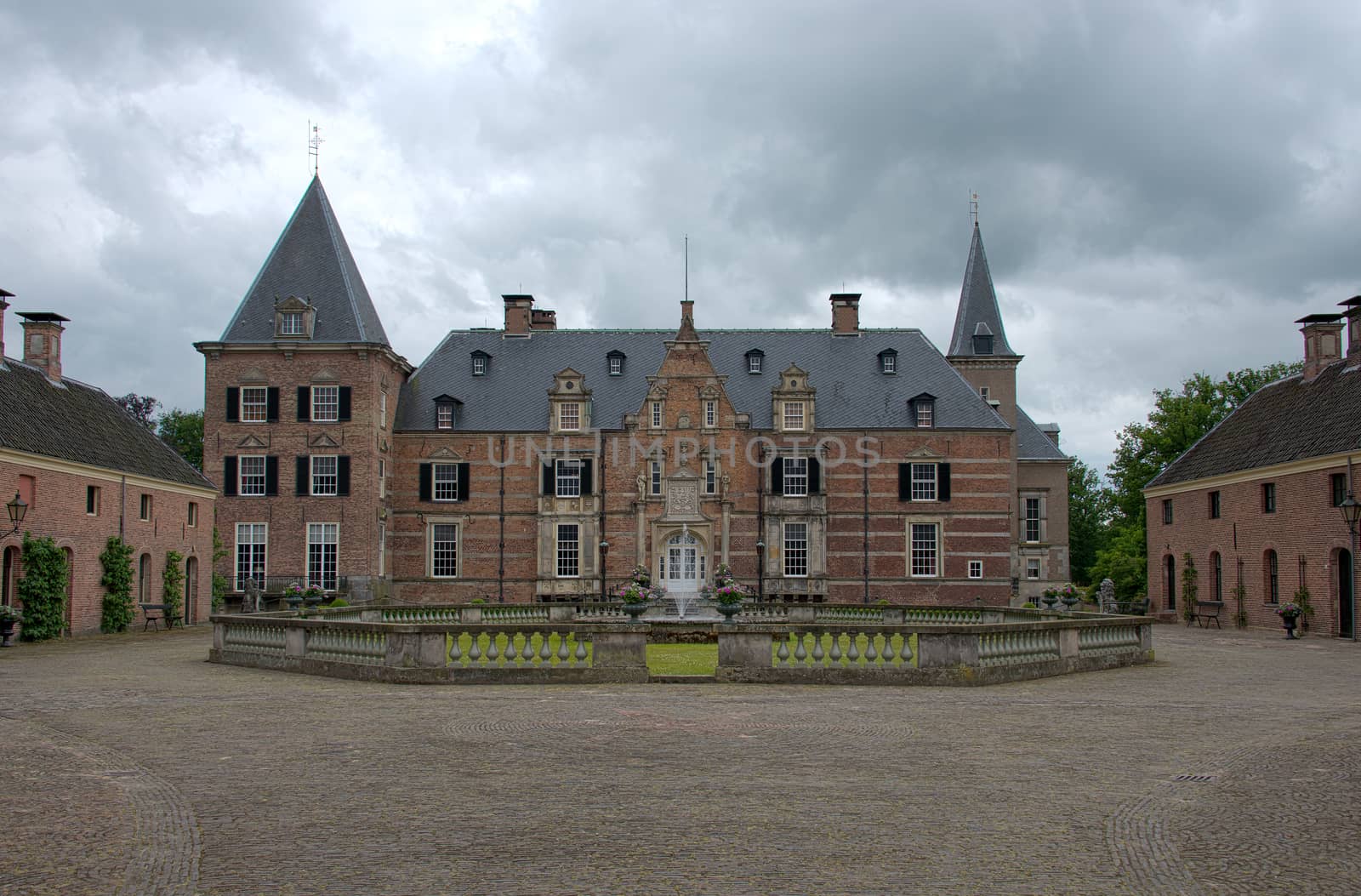 Late medieval castle 'Twickel' with drawbridge and old street near Delden in the Netherlands