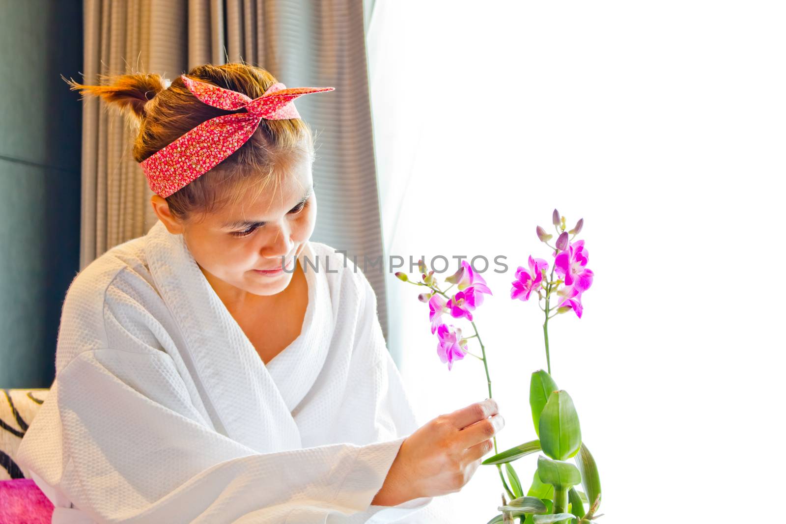 Lady wearing nightgown and flower arrangement in the morning