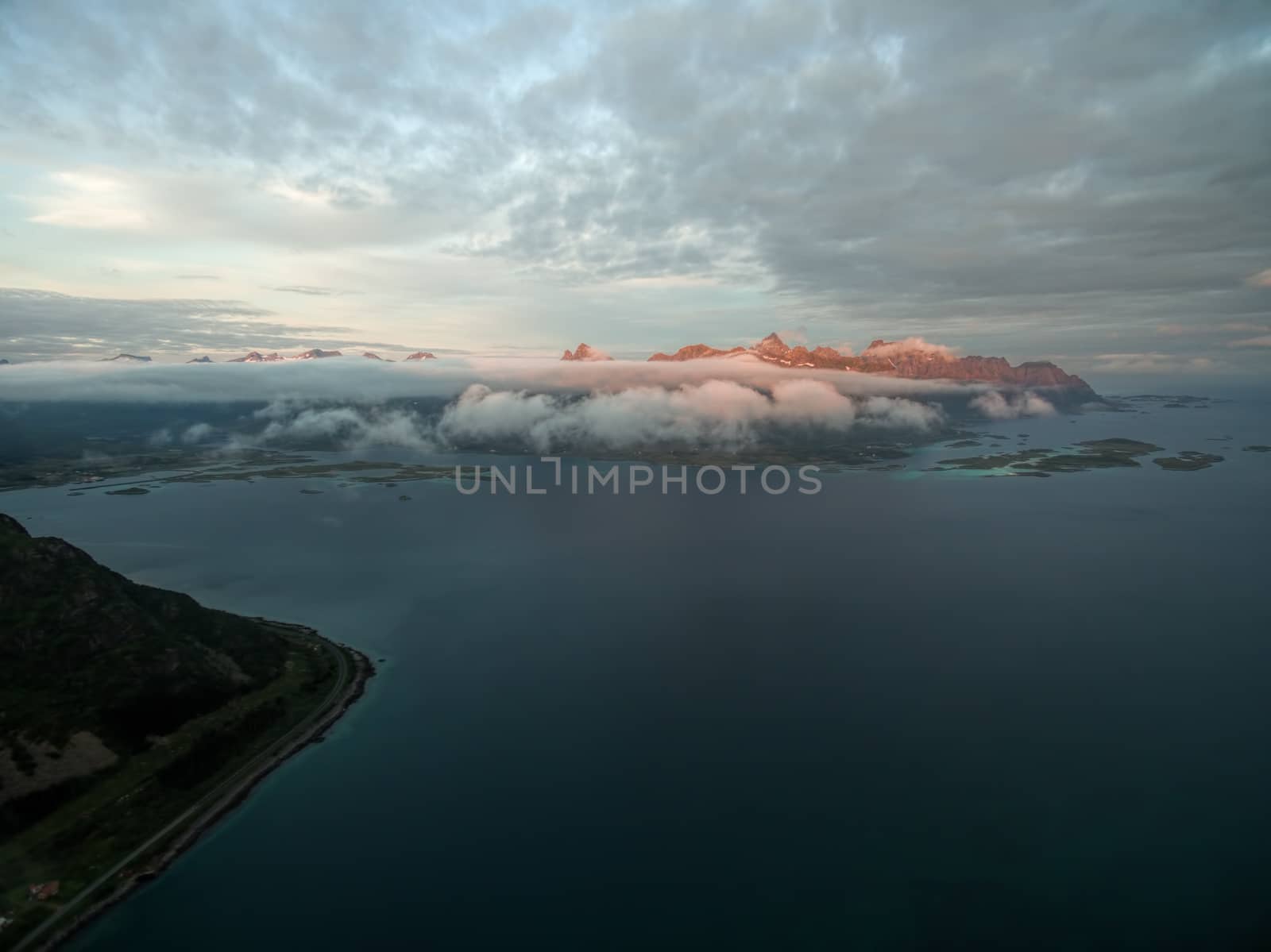 Peaks on Lofoten islands lit by midnight sun