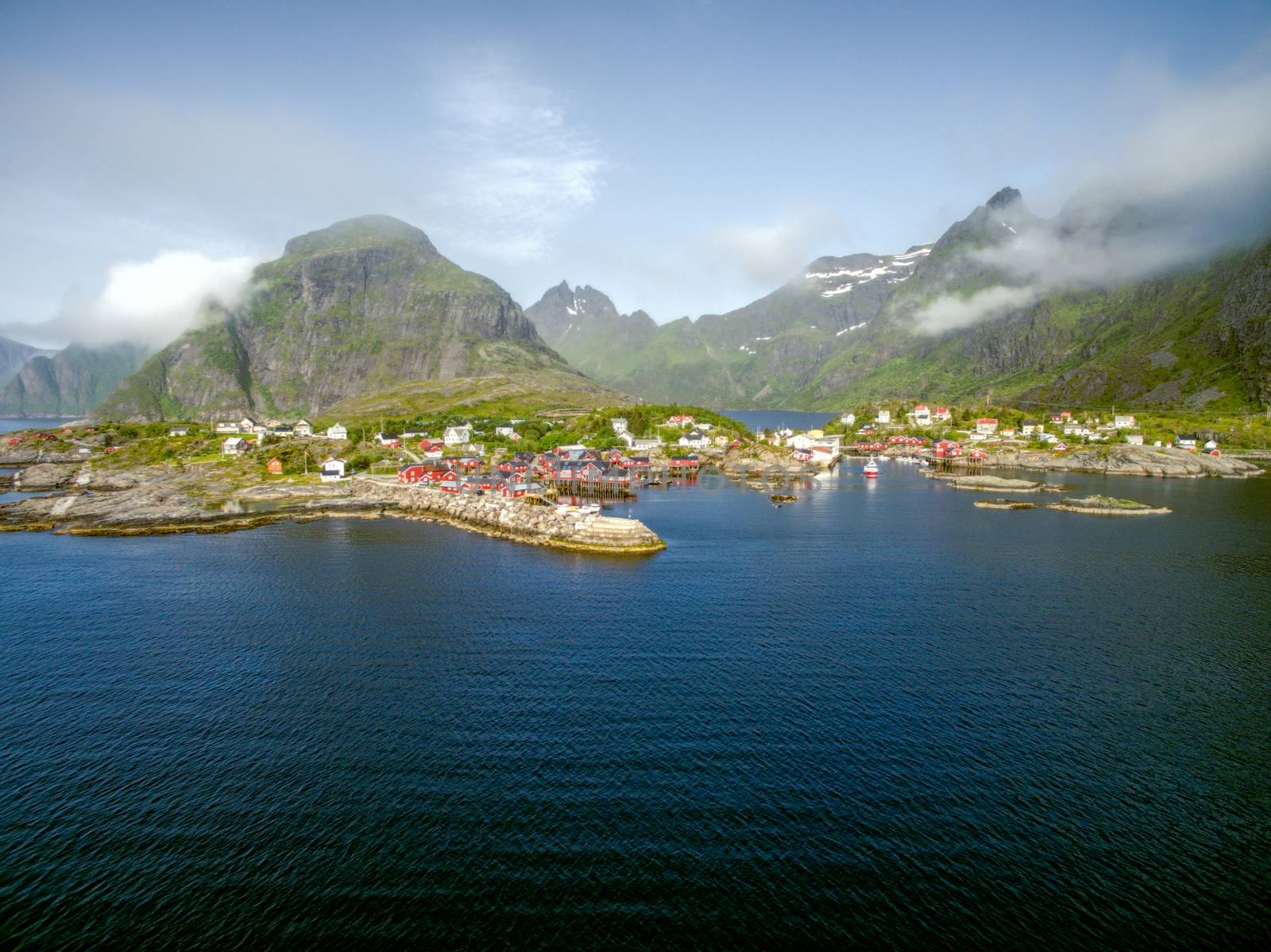Aerial view of scenic fishing village A on Lofoten islands in Norway with traditional red fishing huts