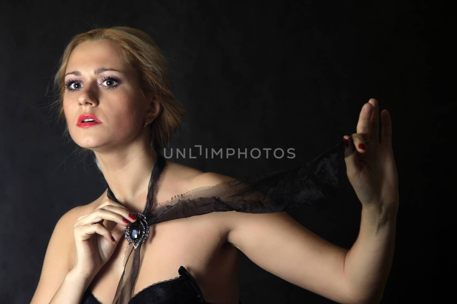 Beautiful young blond woman portrait in studio