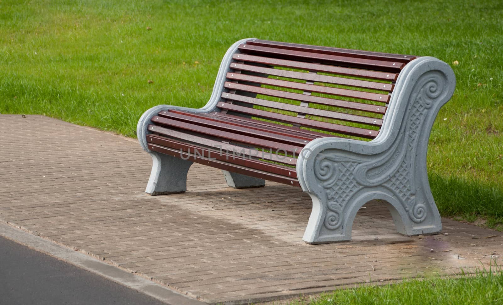  wooden bench in the city park by alexx60