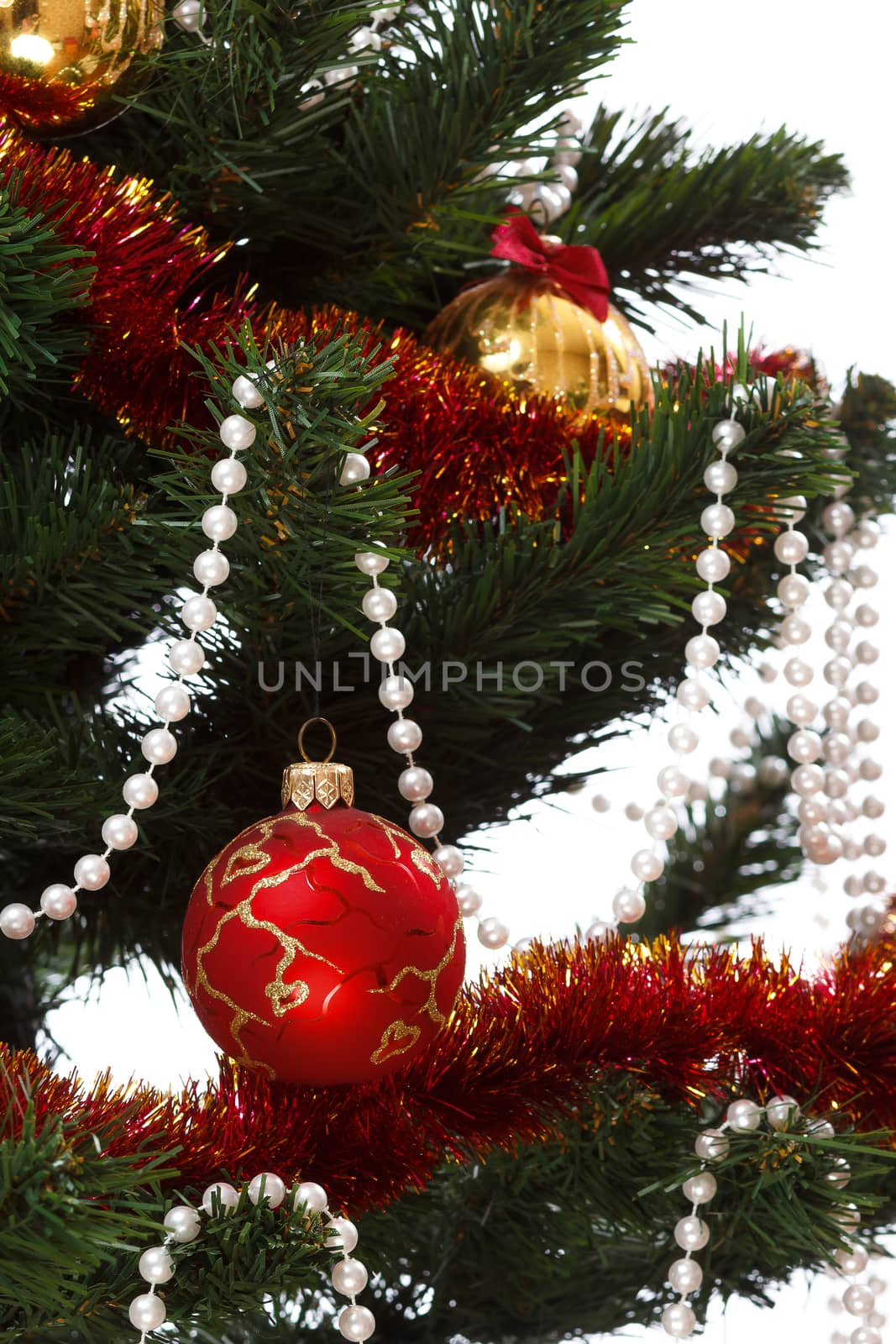 Decorating christmas tree with balls, ribbons and stuff, isolated on white background