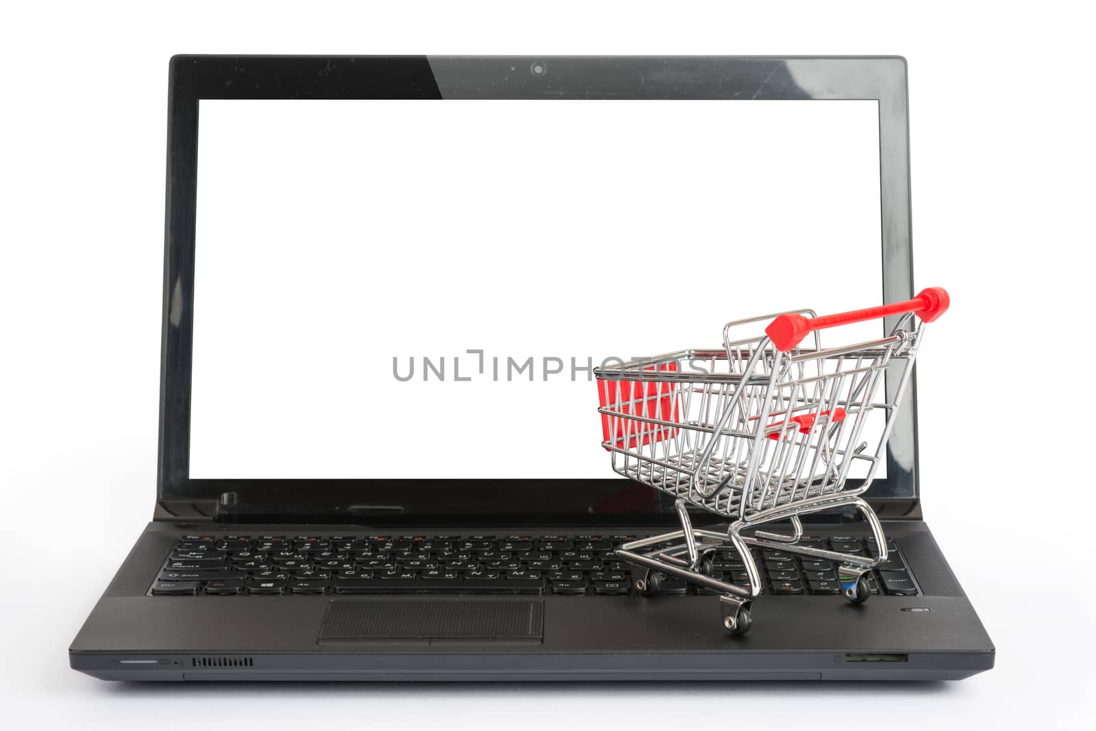 Shopping cart on laptop on isolated white background, front view
