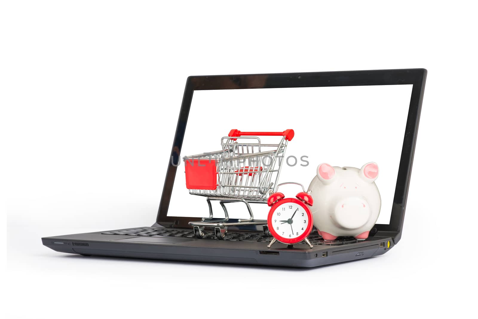 Shopping cart, clock and piggy bank on laptop on isolated white background, front view