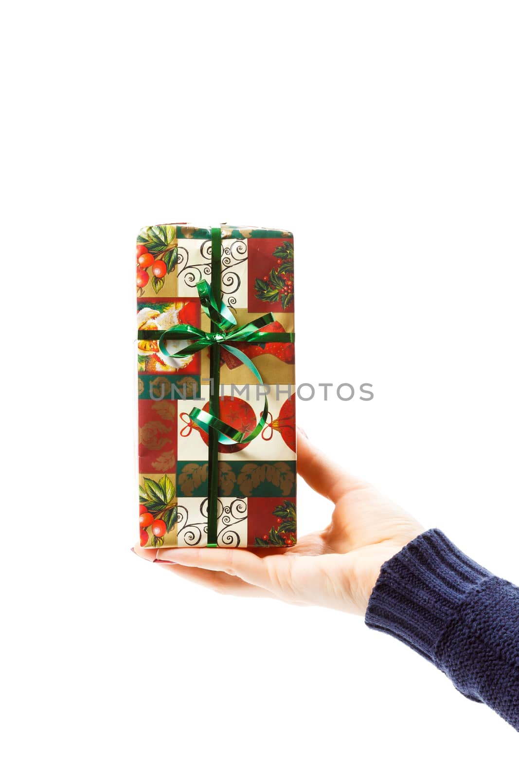 hand with christmas gift isolated on white background