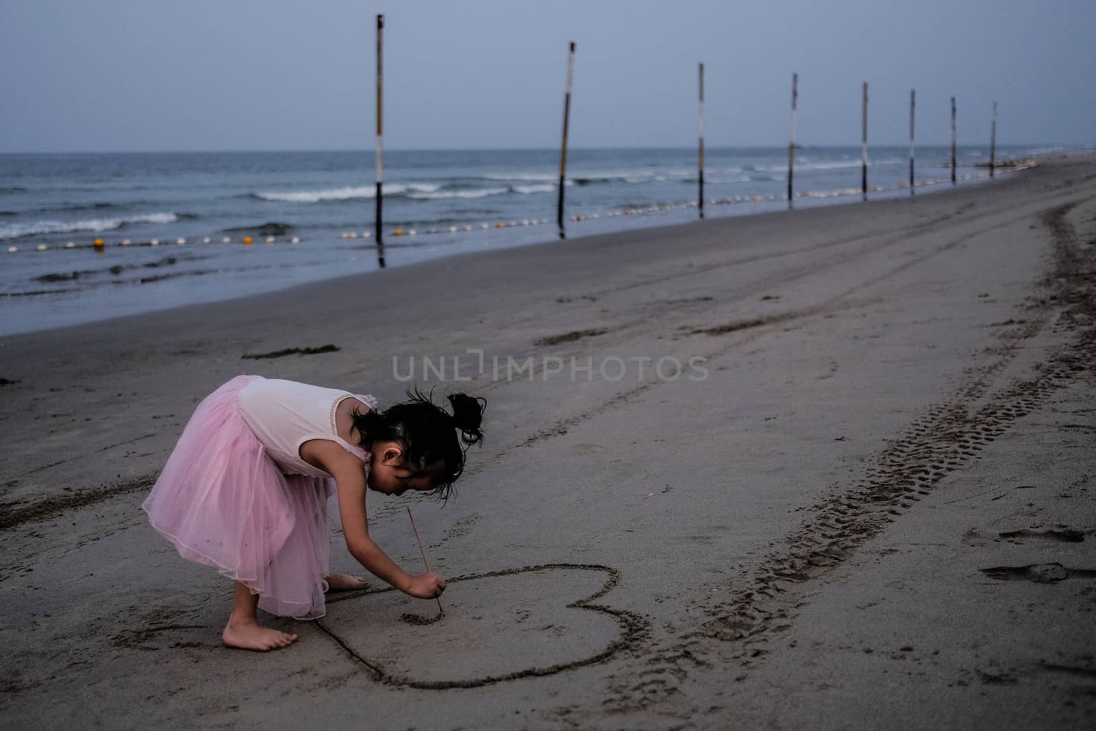 MALAYSIA - HAZE - CHILDREN PLAYING AT BEACH by newzulu