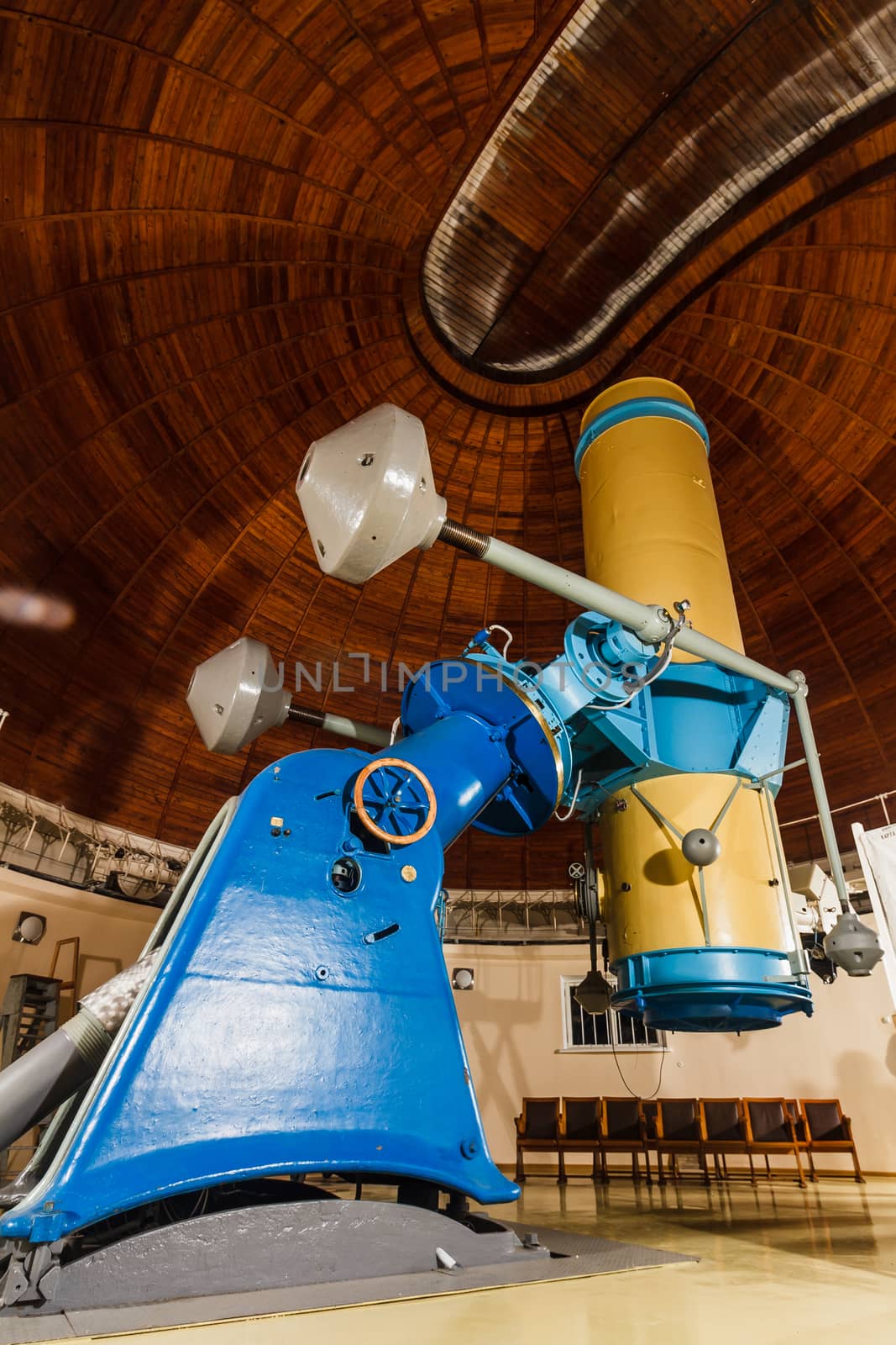 Old trophy large optical telescope at display