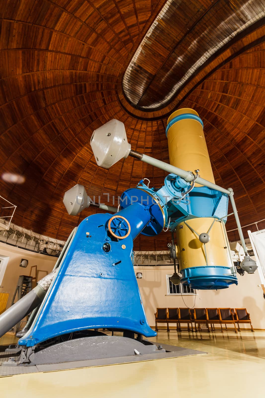 Old trophy large optical telescope at display