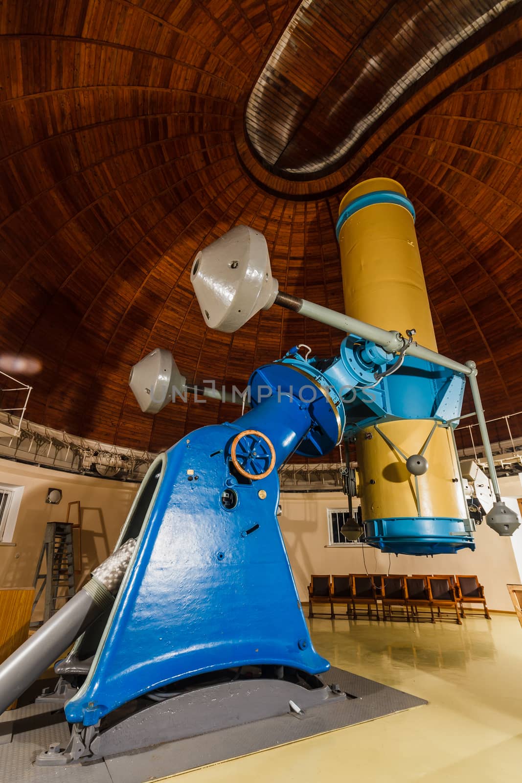 Old trophy large optical telescope at display