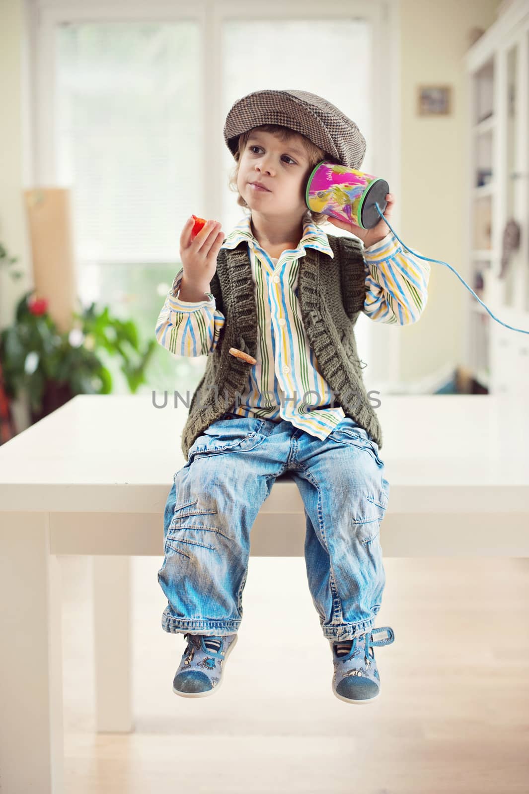 Little boy with tin can telephone by kaliantye