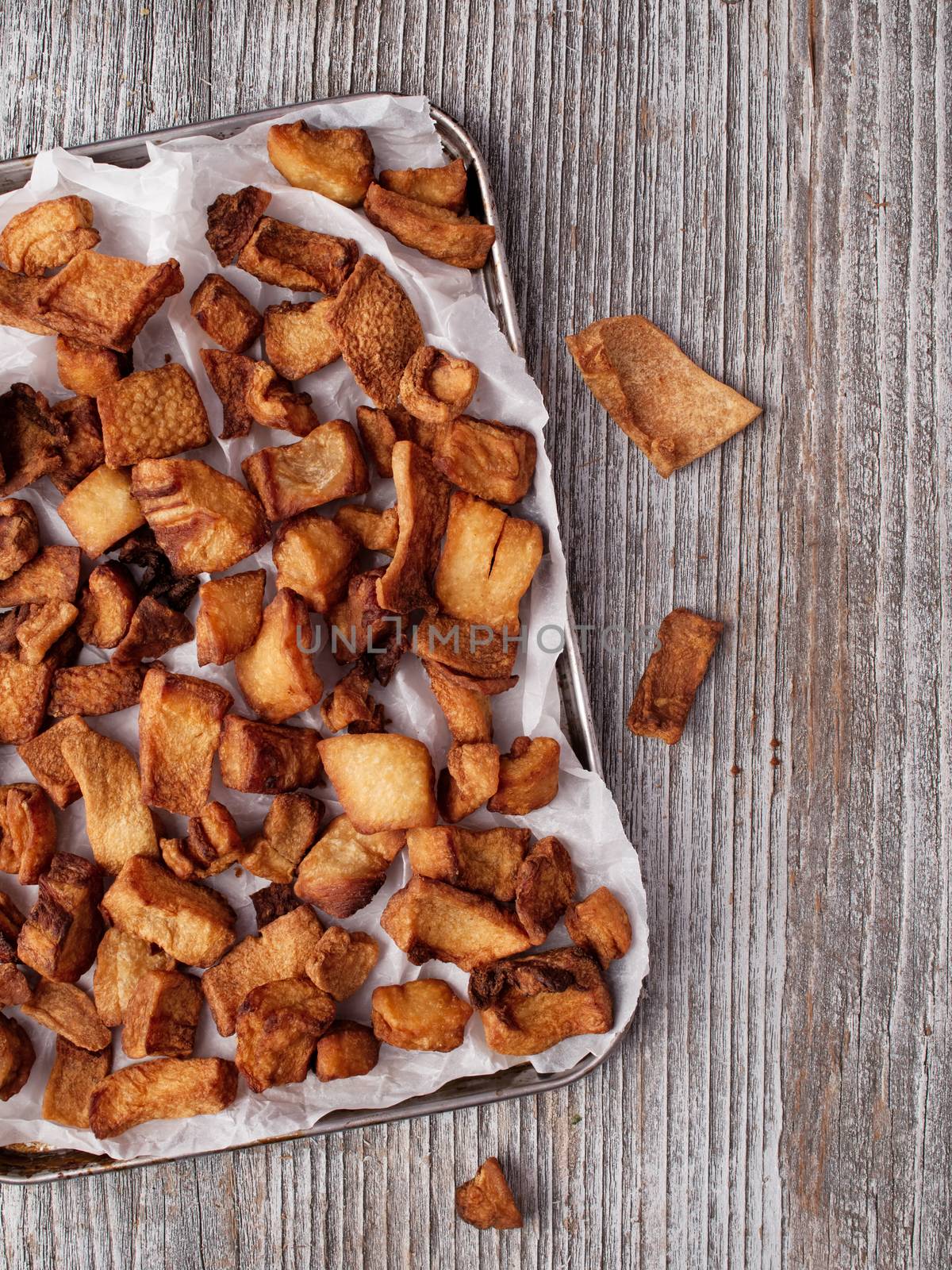 close up of rustic deep fried crispy pork rind