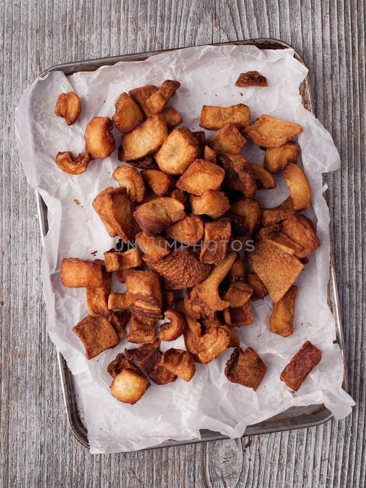 close up of rustic deep fried crispy pork rind