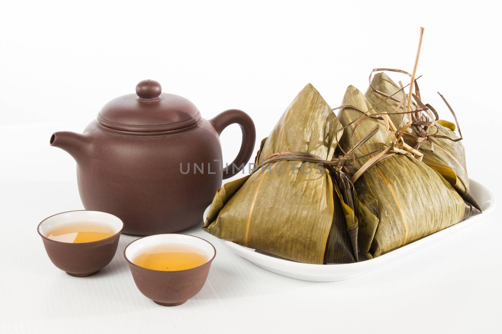 Chinesedumplings, Zongzi in white background with Chinese tea, celebrate for Dragon Boat Festival.