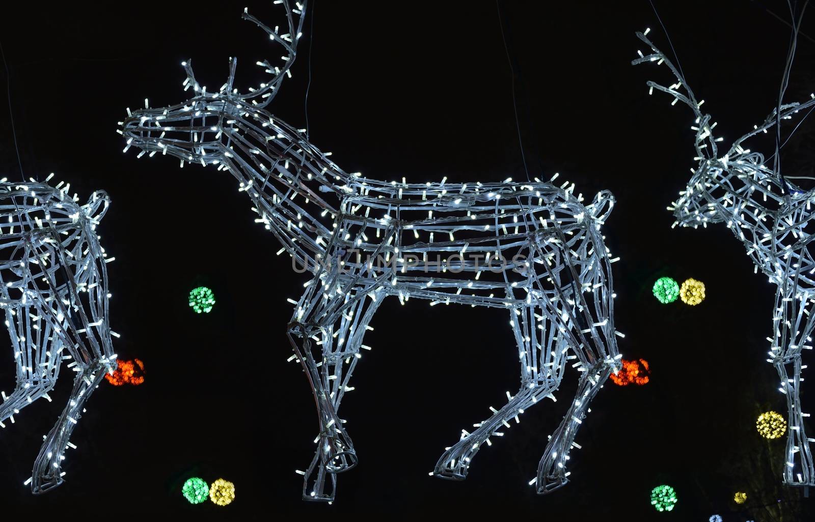white glowing electronic deer in the sleigh of Santa Claus delivering gifts
