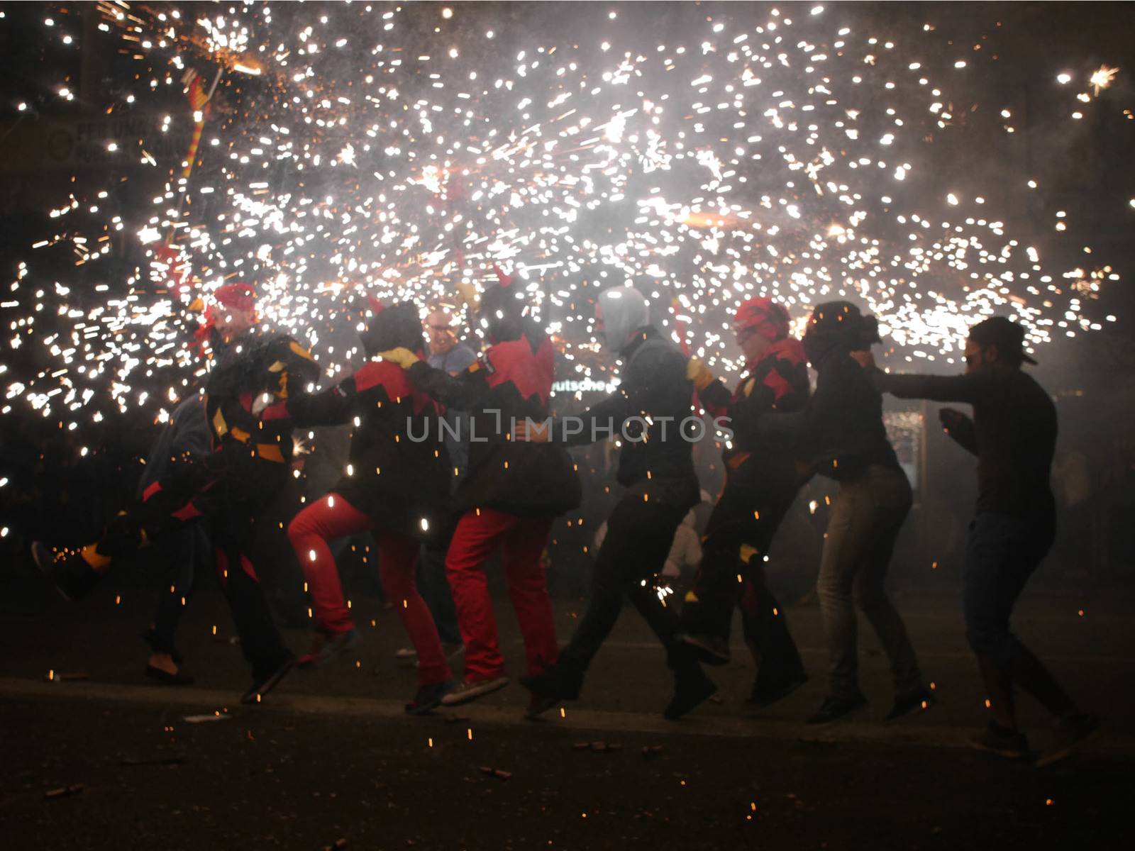 SPAIN, Barcelona; Correfoc, or Firerun, is a traditional Catalan festival held in Barcelona on September 20, 2015, in which groups of people dressed as devils light fireworks. 	The fireworks are directed towards the crowds, and spectators can join in and try to get as close as possible to the fireworks without getting burned. 