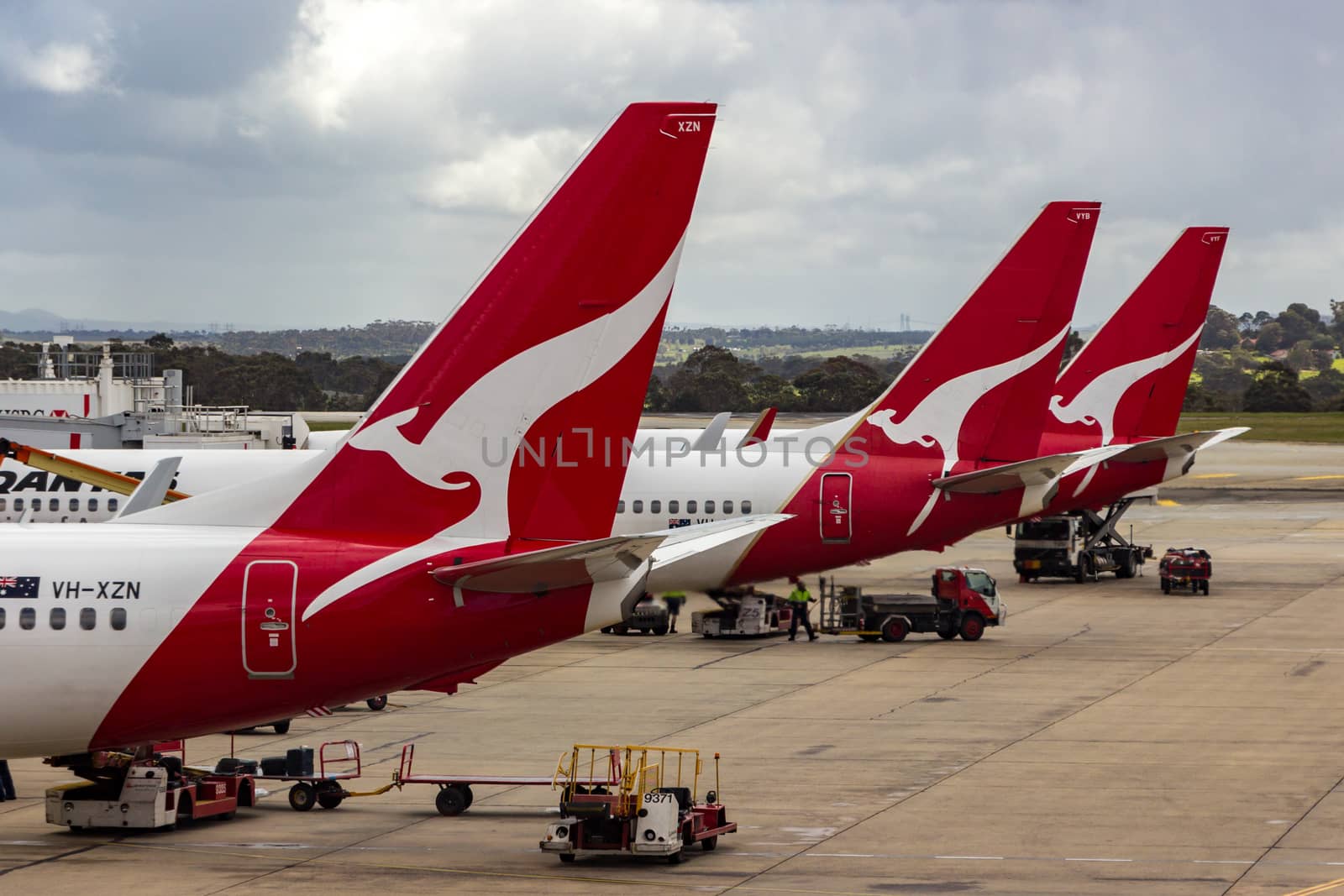 MELBOURNE/AUSTRALIA - SEPTEMBER 22, 2015: Heavy Jetliners parked at passenger terminal taking on passengers