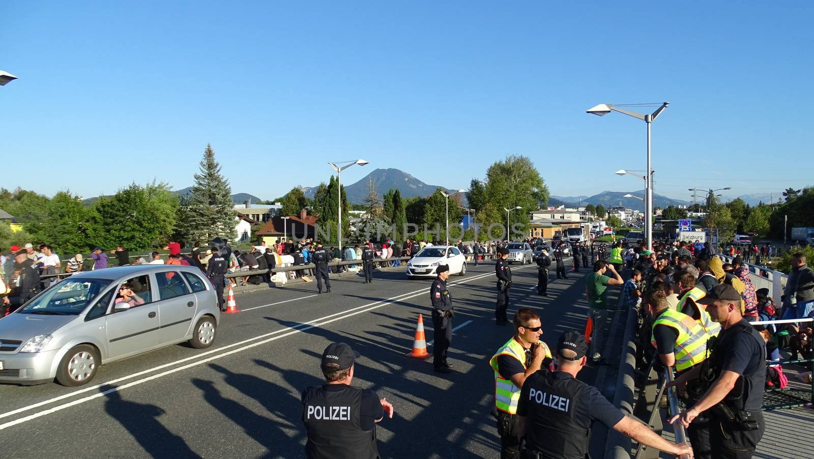 GERMANY, Freilassing: Refugees being stopped by police as they enter Germany from Austria at Freilassing train station, on September 21, 2015. 	The station has become a huge processing camp for migrants heading to Germany, following strict border controls being introduced. German police are now boarding trains from Austria and checking the documents of travellers. 