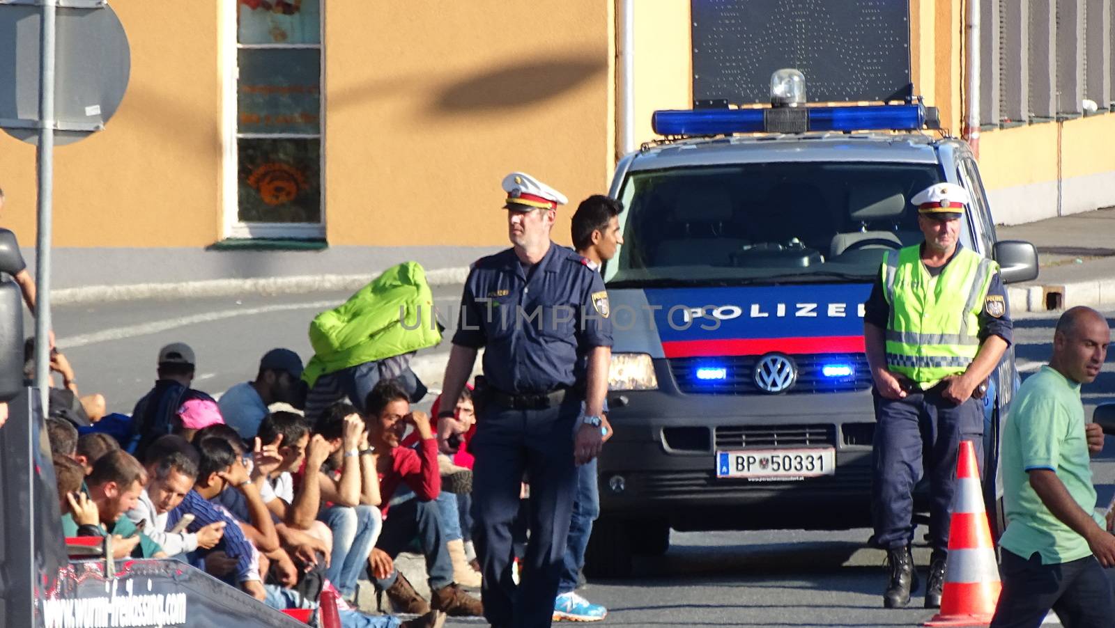 GERMANY, Freilassing: Refugees being stopped by police as they enter Germany from Austria at Freilassing train station, on September 21, 2015. 	The station has become a huge processing camp for migrants heading to Germany, following strict border controls being introduced. German police are now boarding trains from Austria and checking the documents of travellers. 