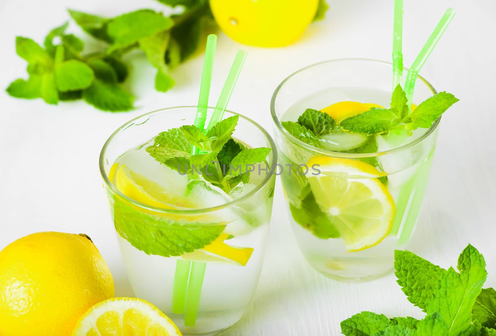 Delicious refreshing lemonade with fresh mint, Lemon, honey and ice. Healthy summer drink.