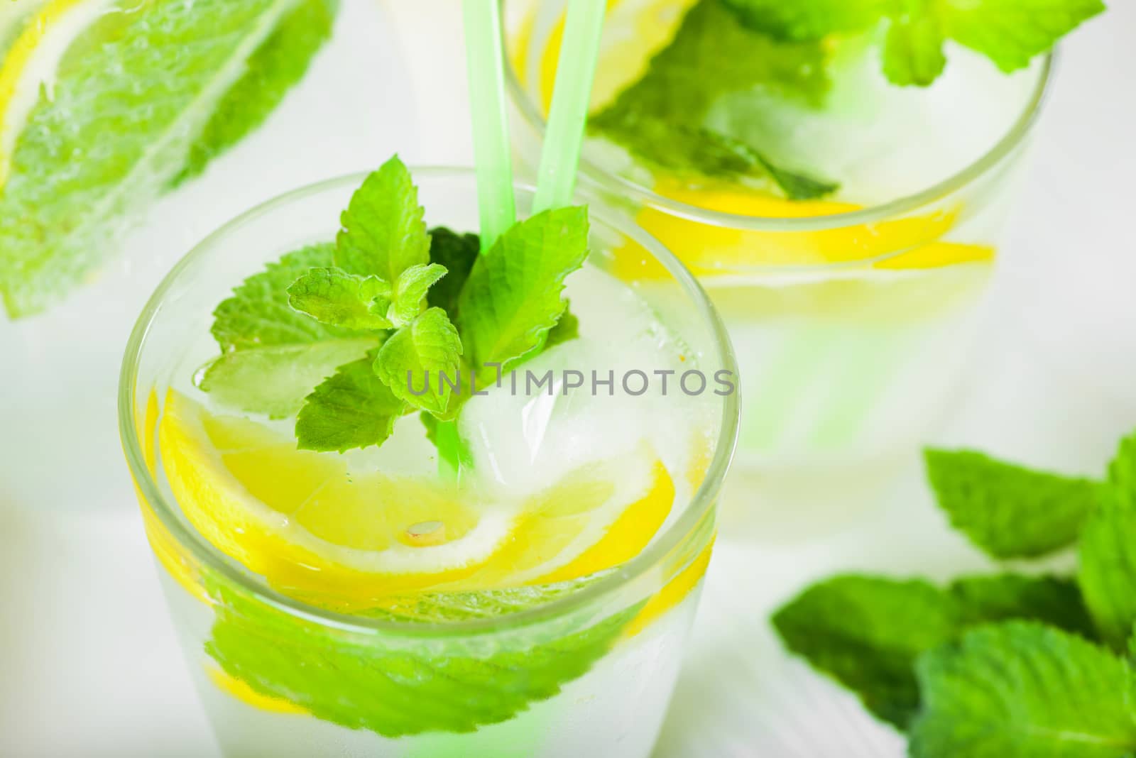 Delicious refreshing lemonade with fresh mint, Lemon, honey and ice. Healthy summer drink.