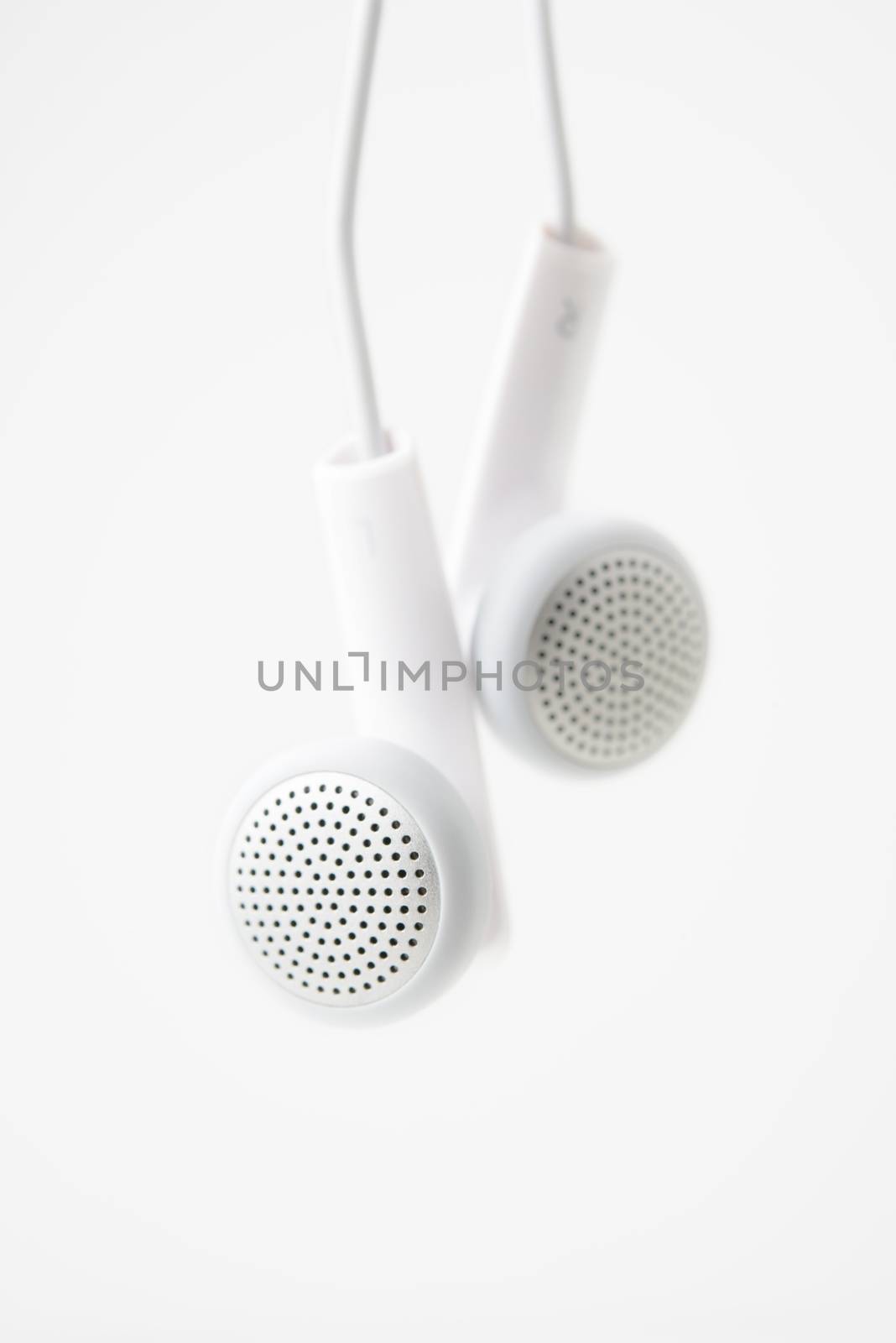 earbuds on white background