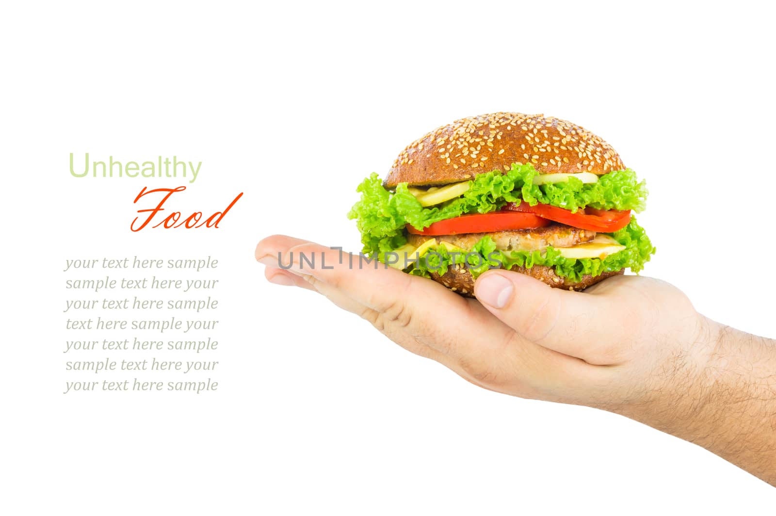 The concept of unhealthy diet, harmful food, overweight, weight loss, diet. Man's hand holding a burger isolated on white background, close up