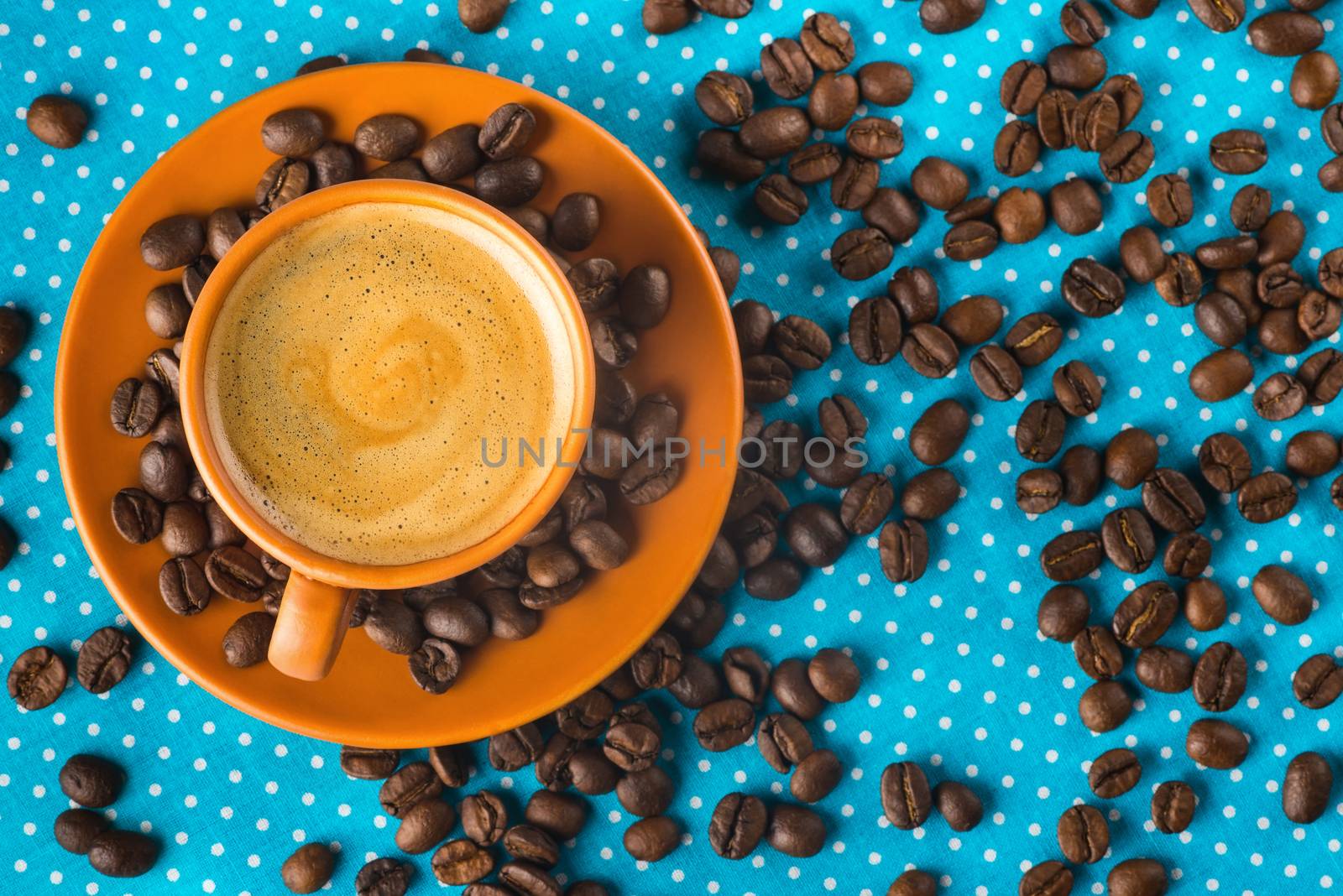 ceramic cup with coffee  espresso on a bright blue background, top view