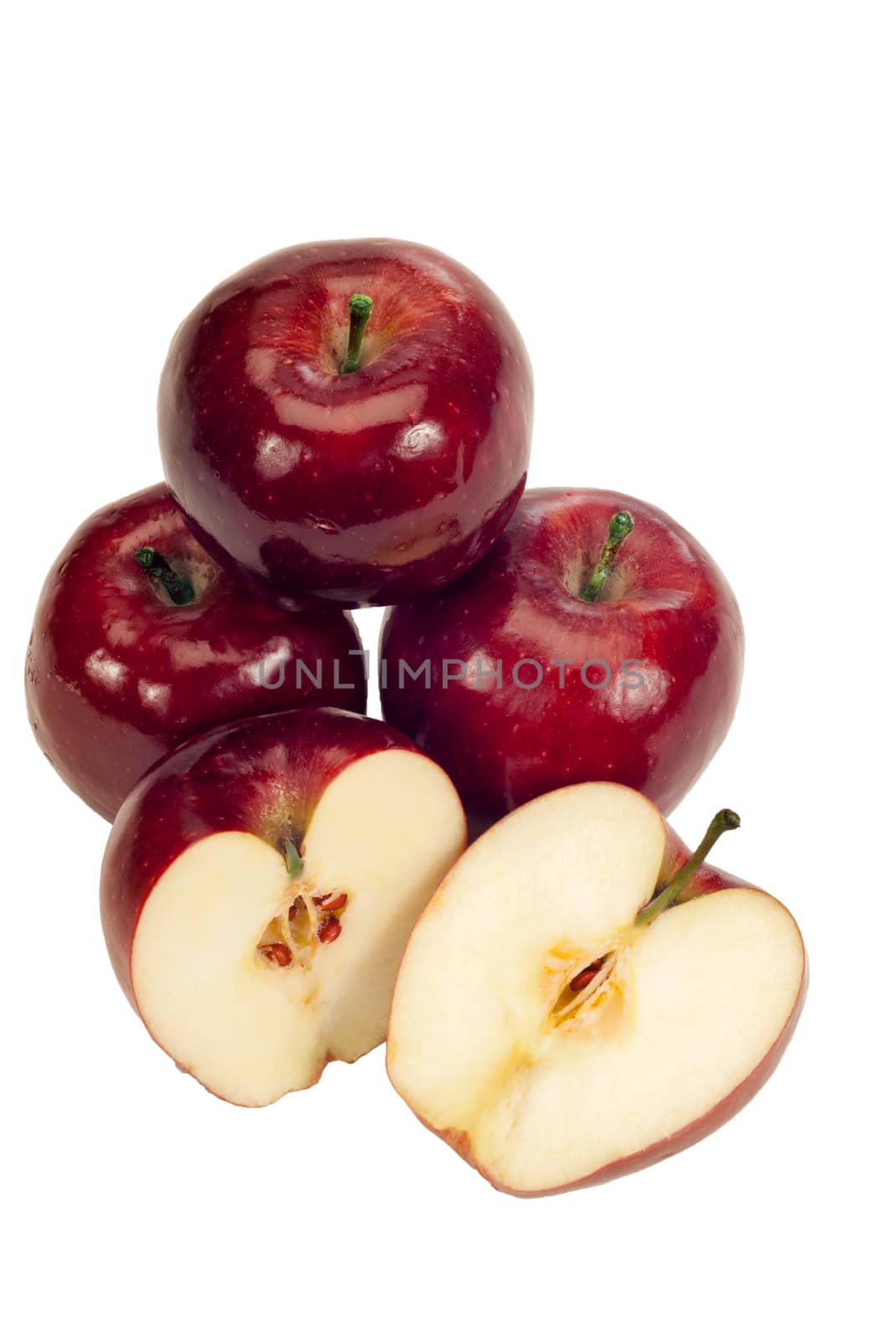 Yummy red delicious apples both whole and sliced on white background. Lots of copy space around.