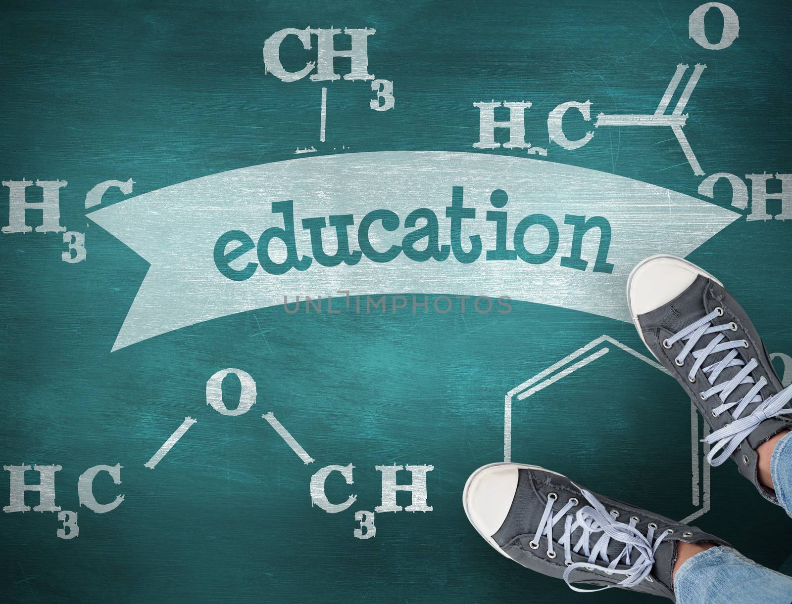 The word education and casual shoes against green chalkboard