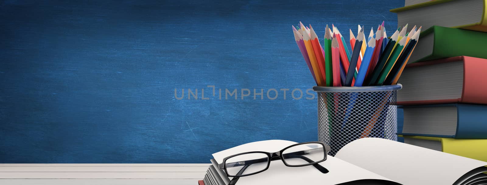 Composite image of school supplies on desk by Wavebreakmedia