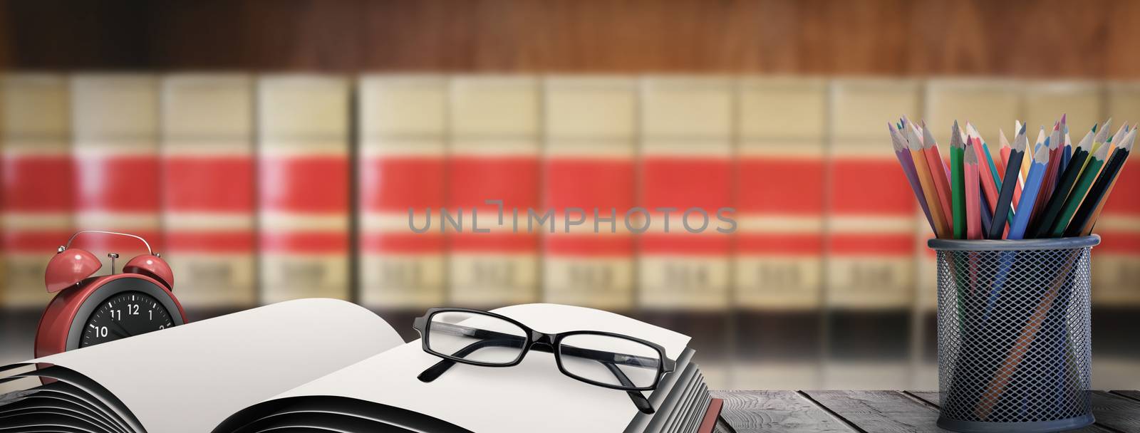 Composite image of school supplies on desk by Wavebreakmedia