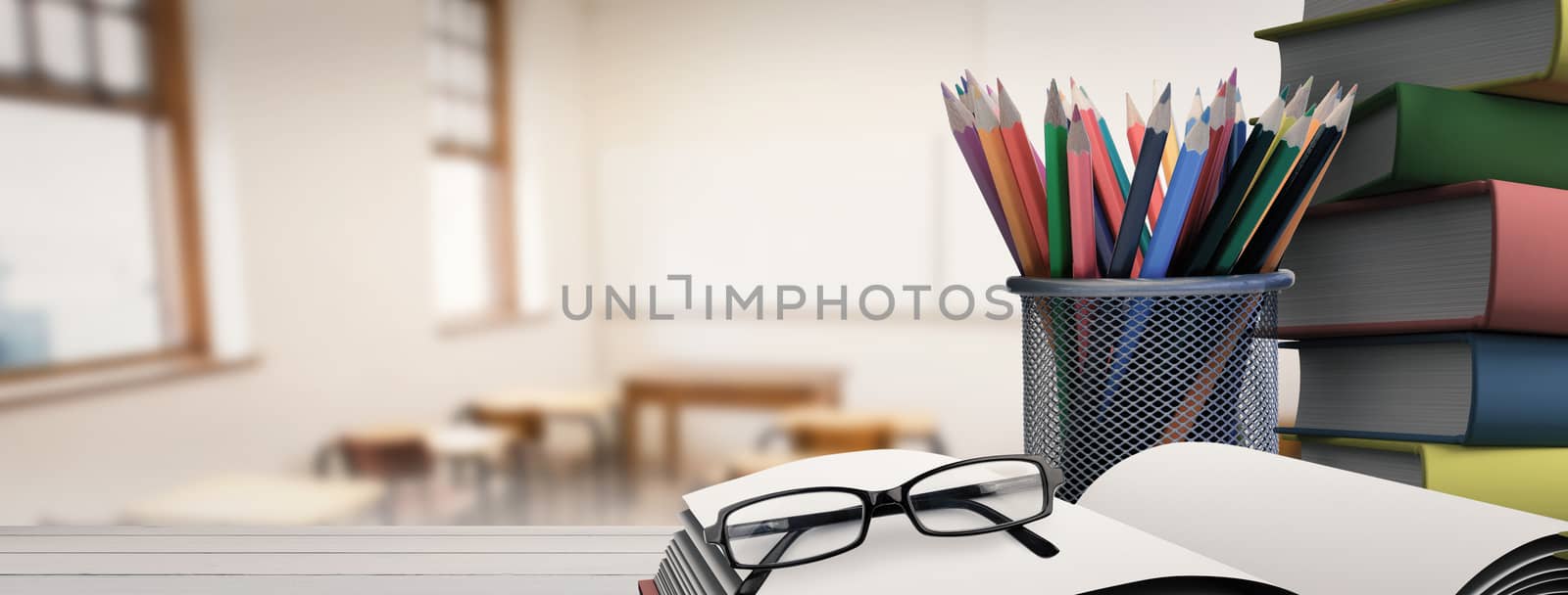 Composite image of school supplies on desk by Wavebreakmedia