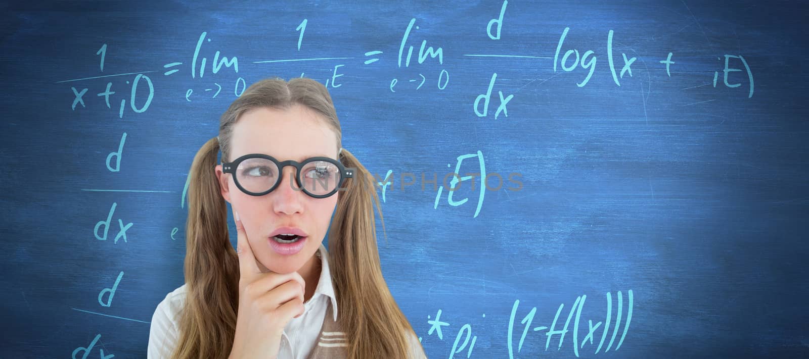 Female geeky hipster looking confused  against blue chalkboard