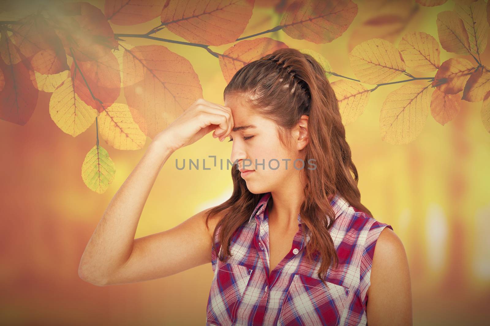 Composite image of a pretty brunette with headache  by Wavebreakmedia