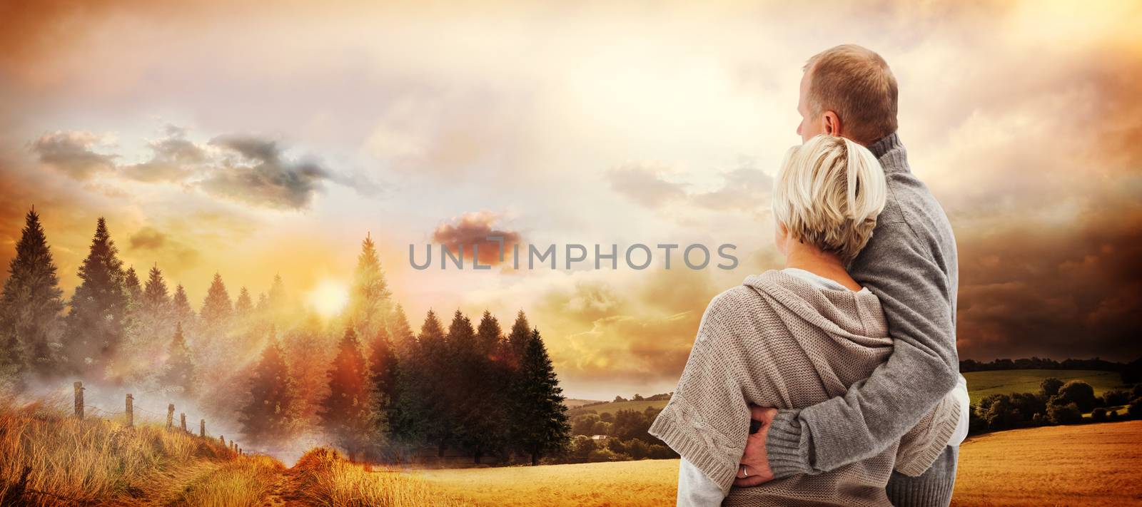 Composite image of happy mature couple in winter clothes by Wavebreakmedia