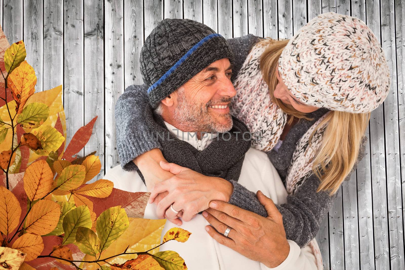 Composite image of happy cute couple romancing while embracing each other by Wavebreakmedia