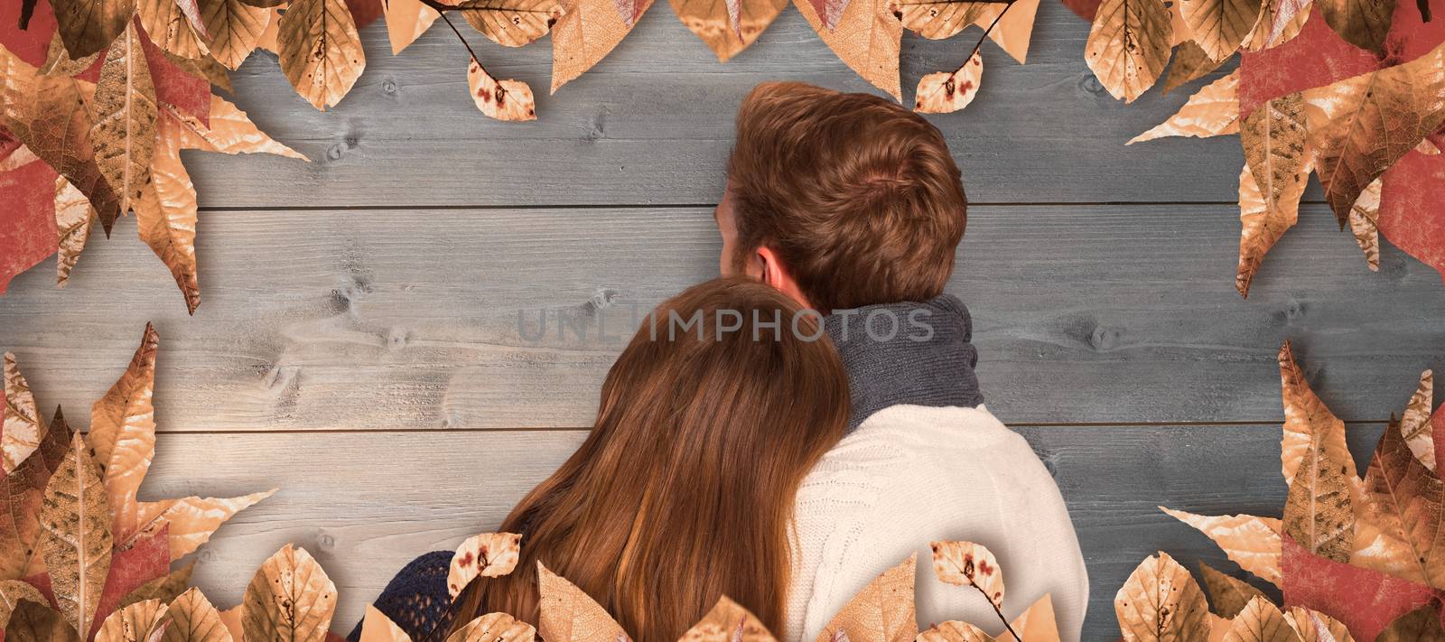 Close up rear view of romantic couple against bleached wooden planks background