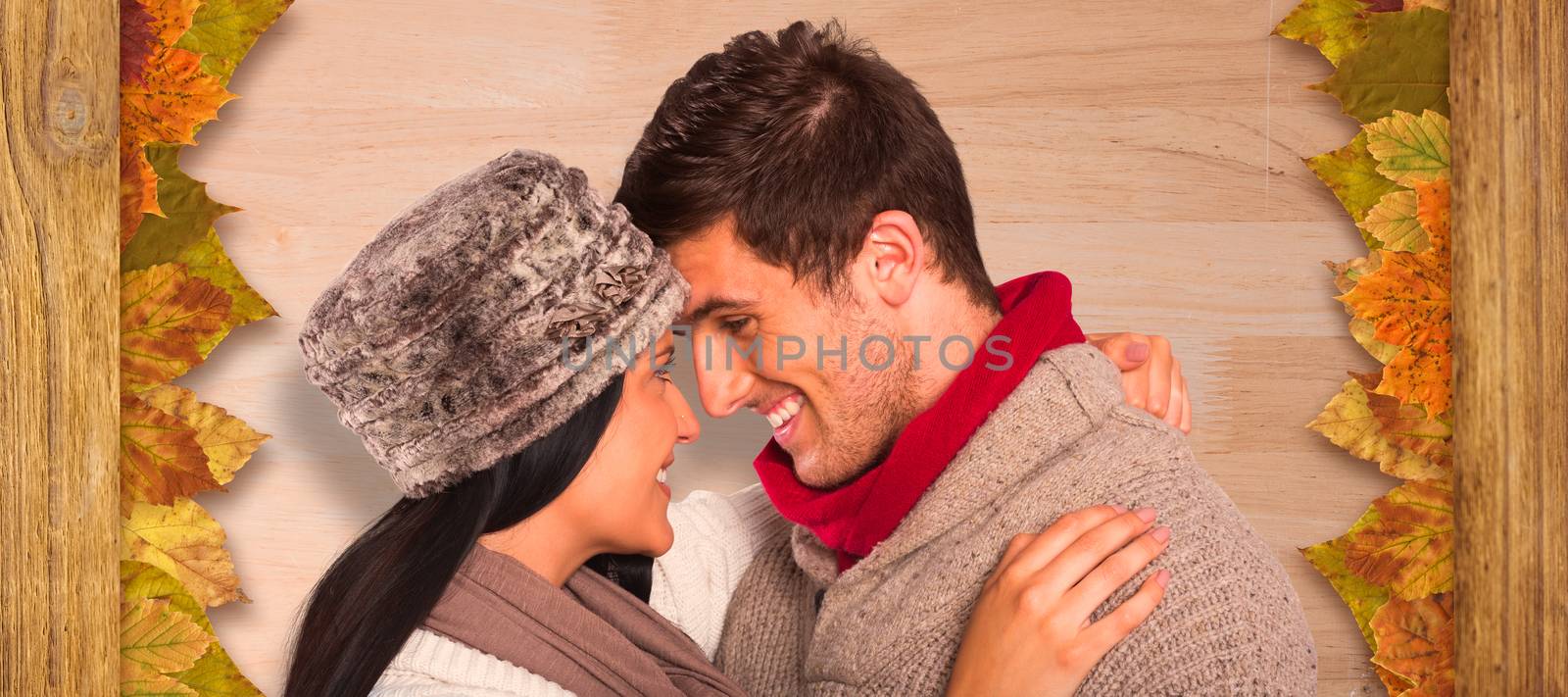 Composite image of young couple smiling and hugging by Wavebreakmedia