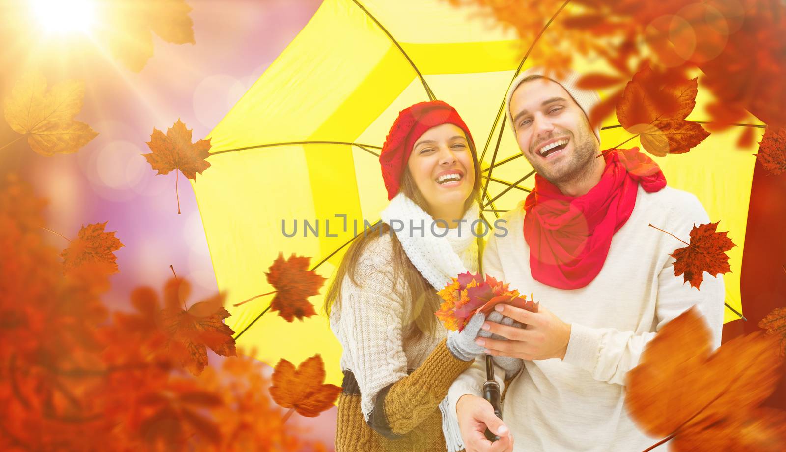 Autumn couple holding umbrella against dark abstract light spot design