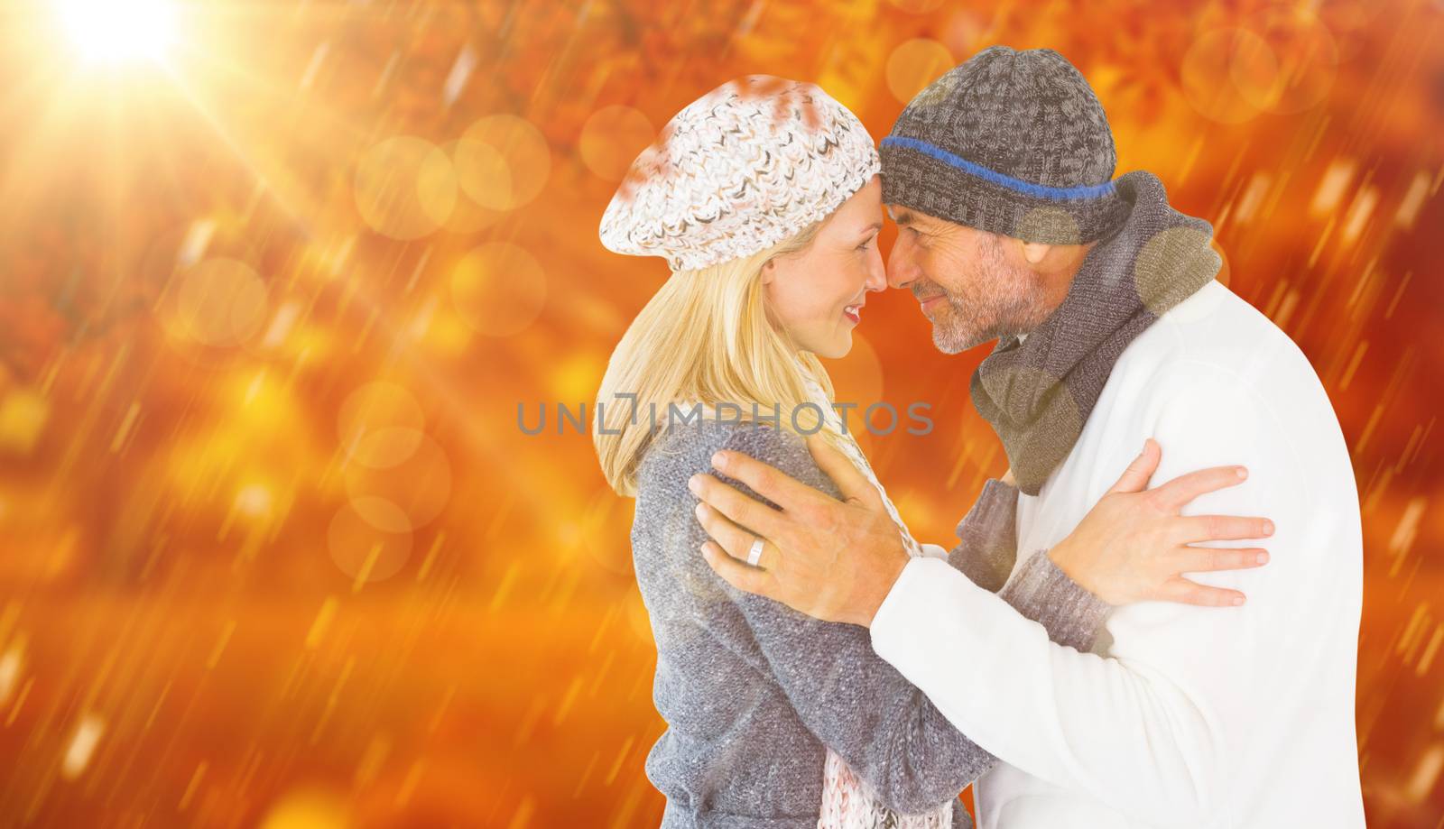 Smiling cute couple romancing over white background against park