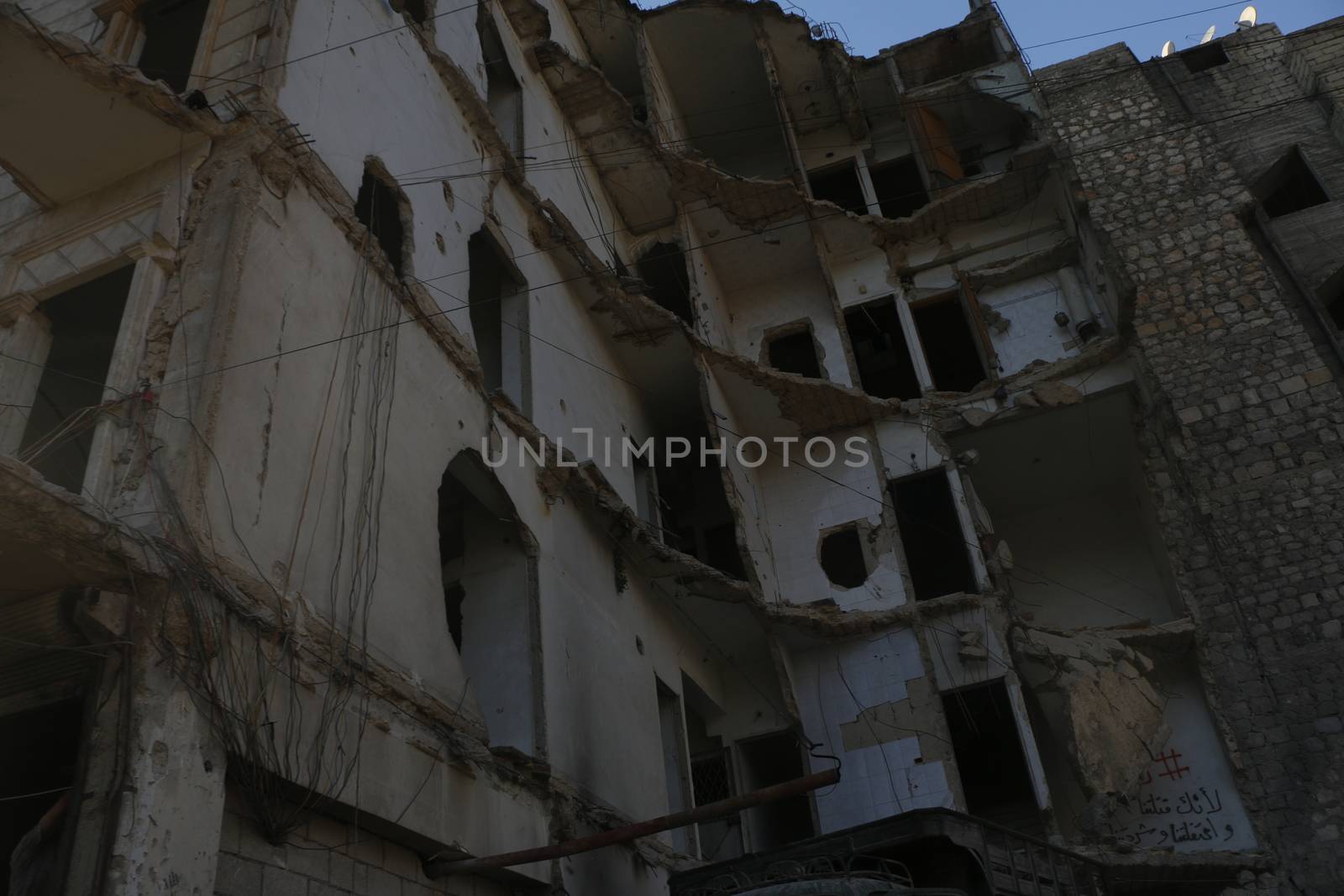 SYRIA, Aleppo: A glimpse into Aleppo, Syria on September 2, 2015, reveals a city destroyed by violence and war.  Little remains of the once populous city, on UNESCO's World Heritage list. Homes, businesses, and basic infrastructure have been severely damaged by years of civil war. The dangerous and unstable conditions are fueling a mass exodus of refugees from Syria into Europe.  The city of Aleppo also serves as an ISIS stronghold. 